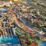 Aerial photograph of Yas Waterworld, showing numerous colorful waterslides, pools, and surrounding landscape.