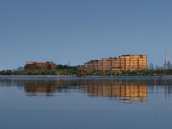 Jebel Ali residential towers with surrounding greenery and blue sky in Dubai